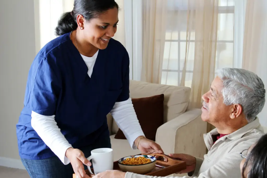 Caregiver helping a senior with homemaking at home